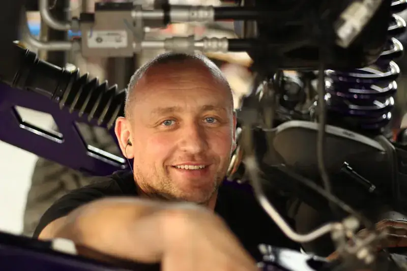 Alexey Kastritskiy under a car on the lift